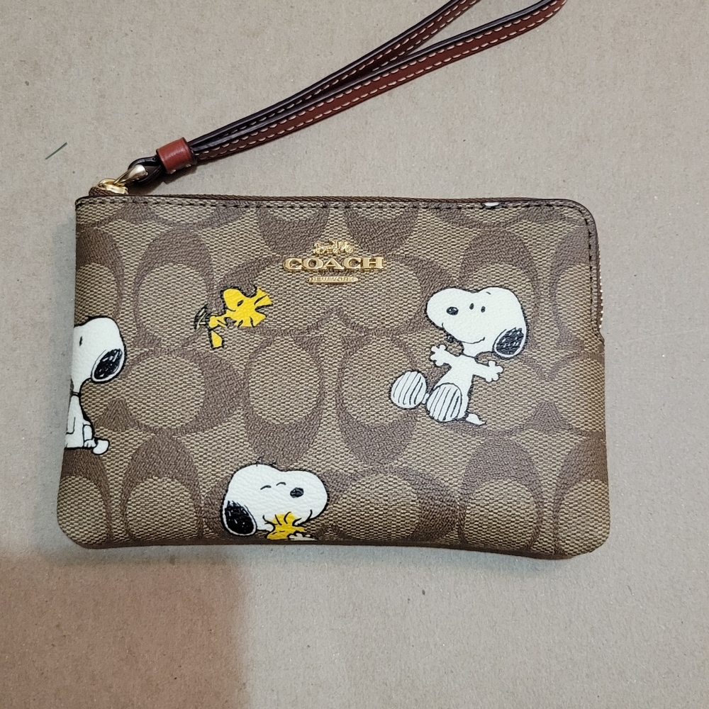 Coach x Peanuts snoopy woodstock wristlet